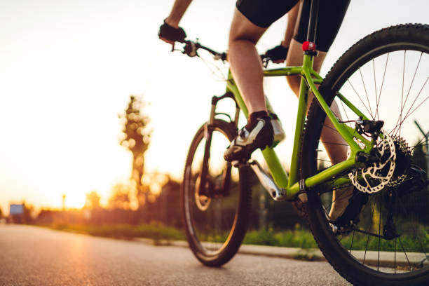 istock Cyclist foot on bicycle pedal 1266144529