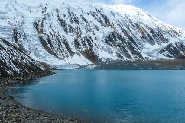 istock Tilicho Lake - A panoramic view on turquoise colored lake in Himalayas 1266145290