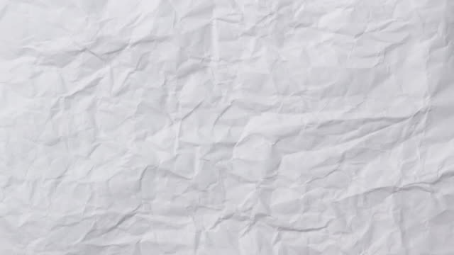White crumpled paper background texture. Stop motion animation. Seamless looping.
