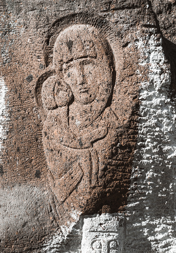 Saint Maria and little Jesus are carved in stone