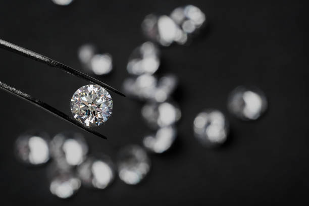 istock Diamond jewelry holding on black 1266149057