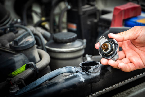 close up of Check the radiator car. Car maintenance, \Bottle, Bottle Cap, Car, Checked Pattern coolant stock pictures, royalty-free photos & images