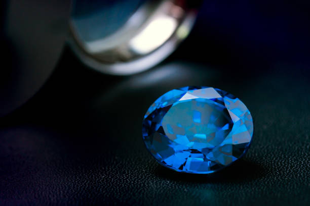 istock natural blue sapphire gemstone on black 1266149133