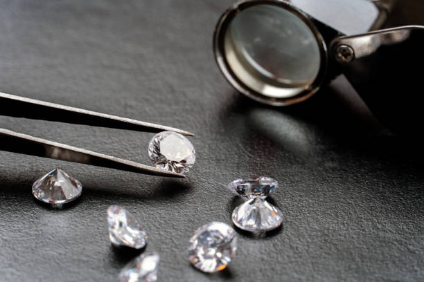 istock Diamond jewelry holding on black 1266149161