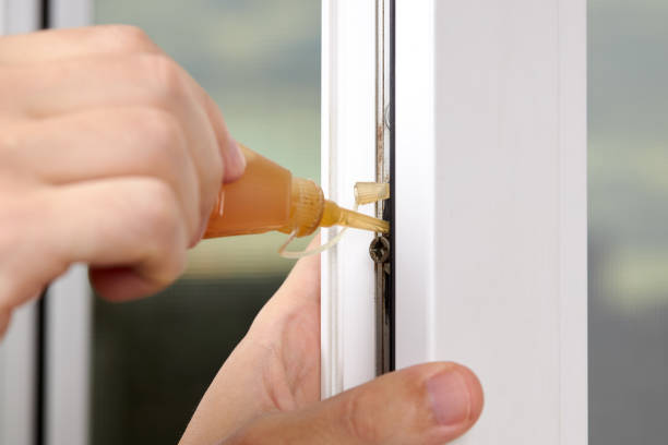 istock handyman adjusting white pvc plastic window indoors. worker using grease lubricant to repair upvc window. homework maintenance 1266151947