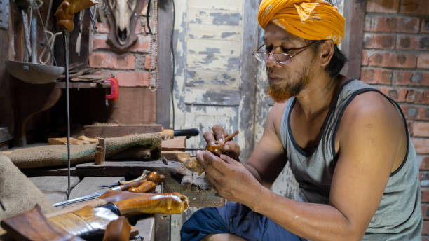 istock Crafting Malay Traditional asymmetrical Dagger called 