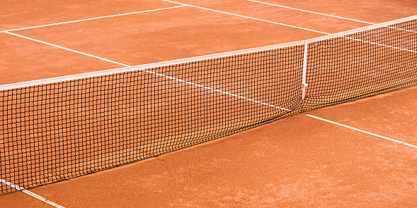 empty clay tennis court view from above