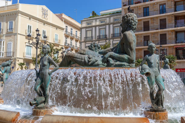 istock Square with a fountain in front of Gothic Valencia Cathedral 1266161311
