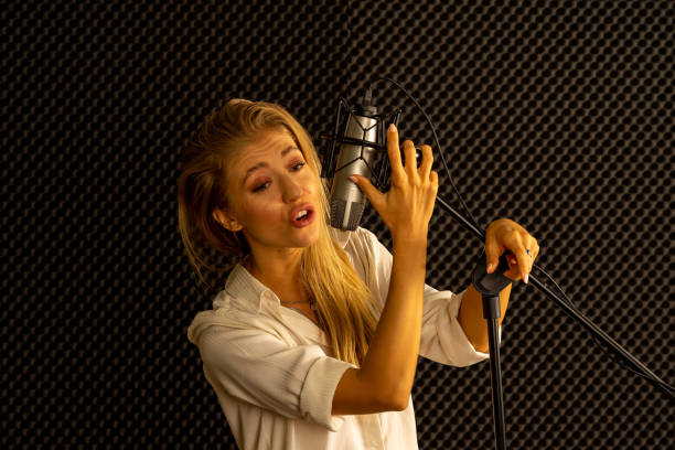 istock European pretty woman sing in musical recording creative studio 1266162665