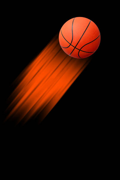 istock Fast moving basketball on a black background 1266162733