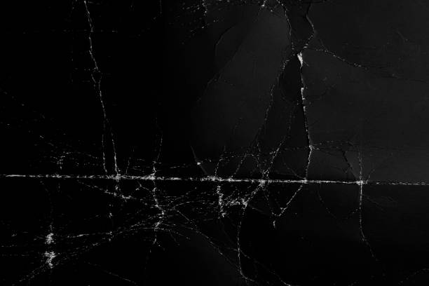istock Crumpled and worn surface of dark black paper 1266163886