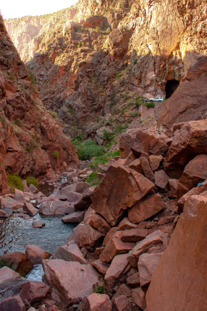 istock Mountain stream flows through red rock desert canyon with road and tunnels in background, located in Gilman Tunnels, Jemez Mountains, New Mexico, USA 1266165174