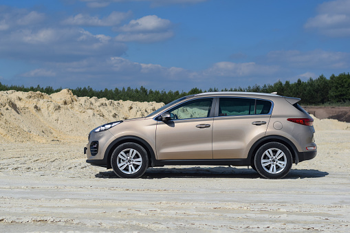 Kluki, Poland - 10 July, 2016: Kia Sportage stopped on the unmade road. The fourth generation of Sportage was debut in 2016 on the market. The Sportage is the most popular SUV in Kia offer in Europe.