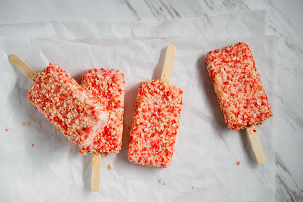 Strawberry Shortcake Icecream Bars Strawberry shortcake ice cream bars with cake crumbles ice pie stock pictures, royalty-free photos & images