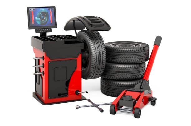 istock Auto Service concept. Wheel Balancing Machine with car wheels, hydraulic floor jack and lug wrench. 3d rendering  isolated on white background 1266169501