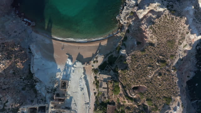 Aerial Overhead Top Down Birds Eye View of an Abandoned Factory Village at Beach on Greek Island