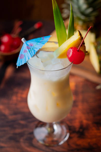 istock authentic pina colada cocktail with pineapple background 1266181637