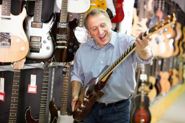 istock male demonstrating an electric guitar 1266187417
