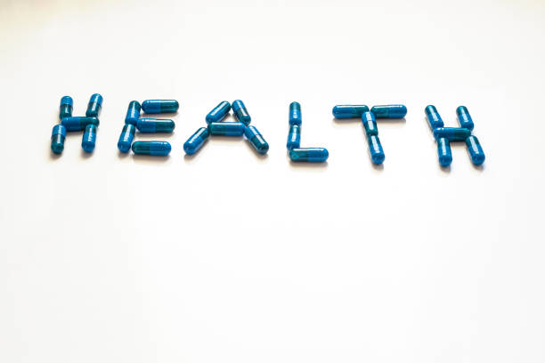 istock blue pills forming the word health perspective view 1266187501