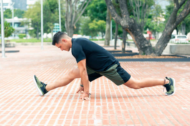 istock Young man exercising outdoors. Sports lifestyle. 1266188913