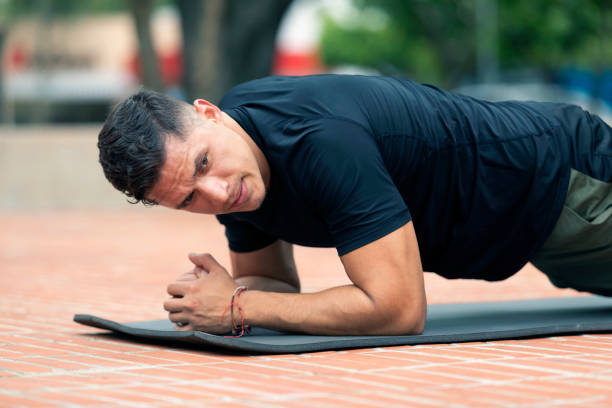istock Young man exercising outdoors. Sports lifestyle. 1266188939