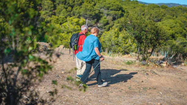 istock Compatible Senior Spanish Friends Enjoying Coastal Hike 1266190288