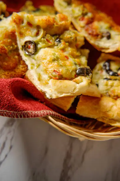 Italian appetizer black and green olive cheesy garlic bread