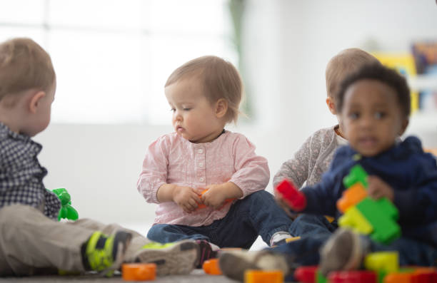 istock Diverse group of babies playing together 1266193528