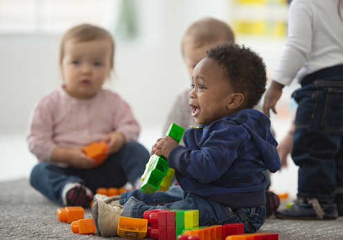 Diverse Group Of Babies Playing Together Stock Photo - Download Image