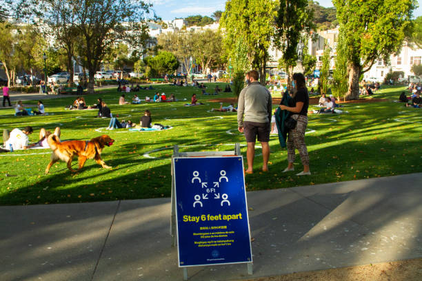 San Francisco City Life During Covid-19 San Francisco, CA - August 13th, 2020: Signs and white circles have been set up in Washington Square Park to help people social distance during Covid-19 san francisco county city california urban scene stock pictures, royalty-free photos & images