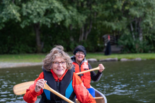 istock Active senior women canoeing on vacation 1266207106