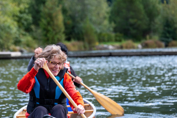 istock Active senior women canoeing on vacation 1266207146