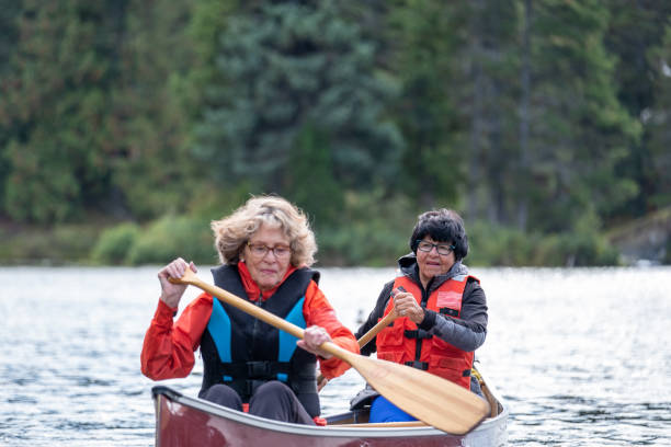 istock Active senior women canoeing on vacation 1266207669