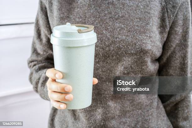 Girl Holds In Her Hands Reusable Eco Coffee Cup Zero Waste Concept Stock Photo - Download Image Now