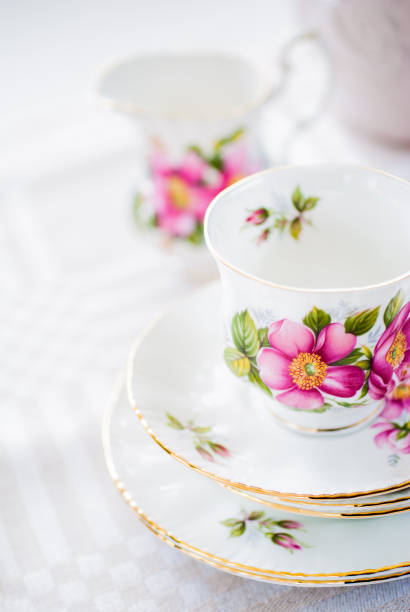 istock Vintage tea or coffee cup with gold rim and rose pattern 1266214133