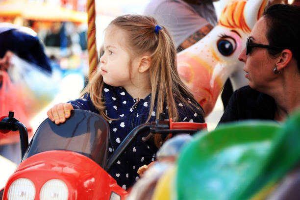 istock Mother and her kid in amusement park 1266214333