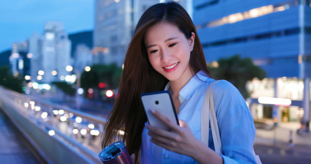istock woman use smartphone outdoor 1266215044
