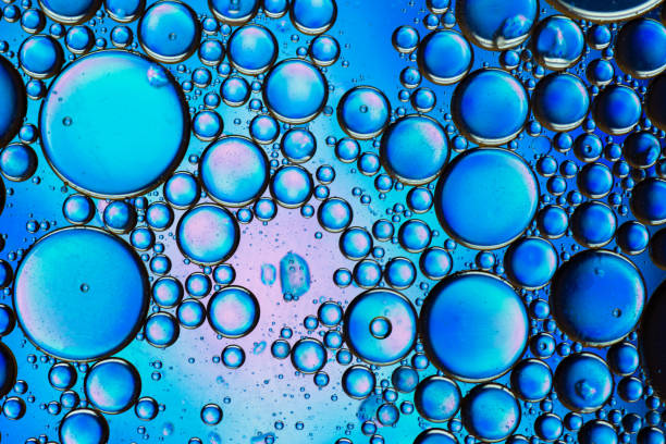 istock Abstract colorful bubbles. Mixing water and oil. Unrealistic colored blue bubbles. Can be used as a festive background 1266215967