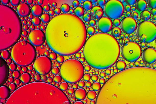 istock Abstract colorful bubbles. Mixing water and oil. Unrealistic colored bubbles, different color filters 1266215992