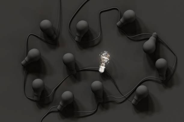 istock Outstanding Light bulb Glowing one among Black light bulb on black color background Top view. 3D Render. Minimal concept idea. 1266216875