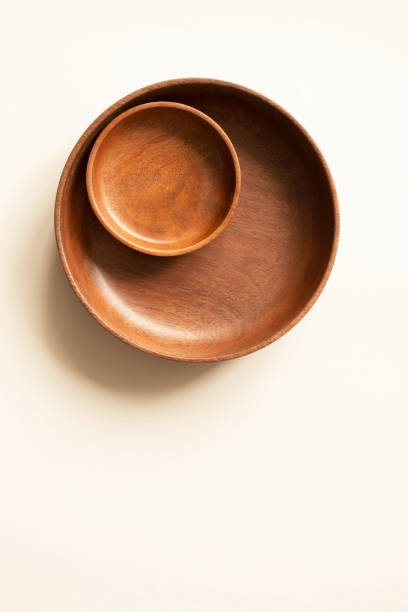 istock Empty two wooden plates, above. Round dishes on light beige background with copy space. Mockup for menu or recipe, vertical 1266218489