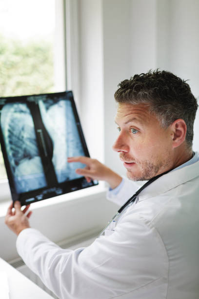 istock Doctor discusses X-ray image via video conference 1266223459