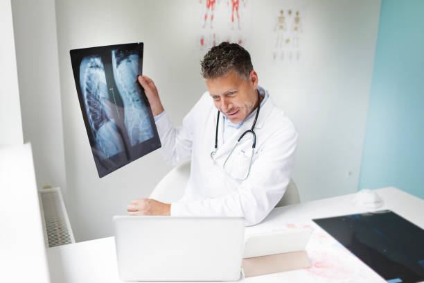 istock Doctor discusses X-ray image via video conference 1266223469