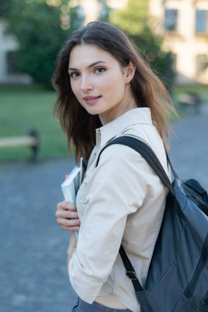 istock Young beautiful girl student in shirt 1266223698