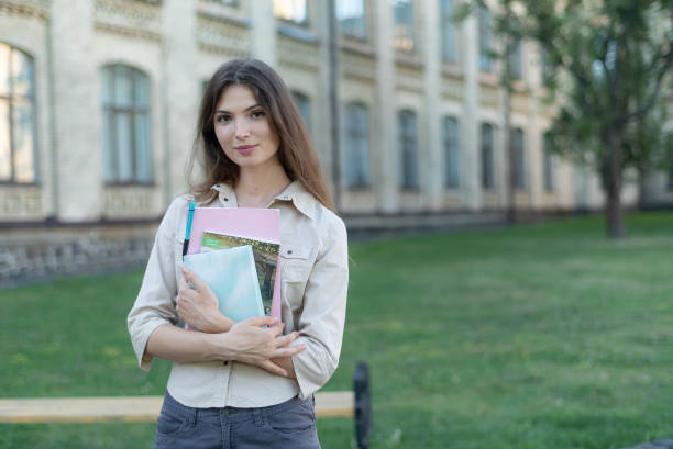 istock Young beautiful girl student in shirt 1266223719