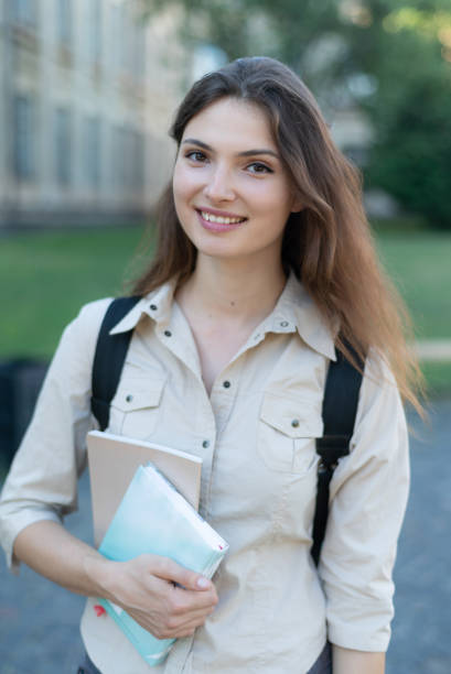 istock Young beautiful girl student in shirt 1266223762