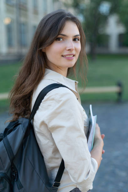 istock Young beautiful girl student in shirt 1266223772