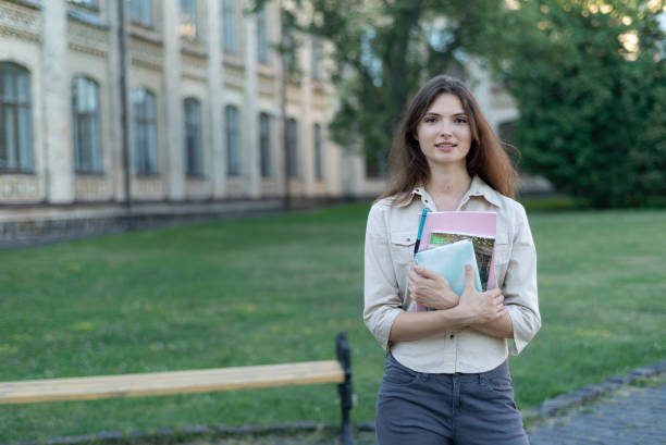 istock Young beautiful girl student in shirt 1266223773