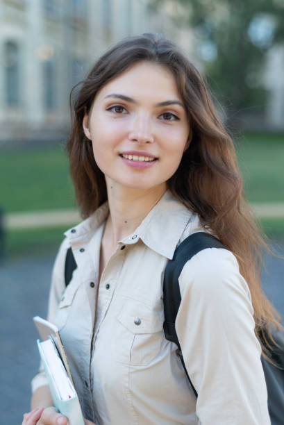 istock Young beautiful girl student in shirt 1266223780