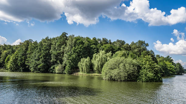 istock Green Peninsula on the city pond 1266231608